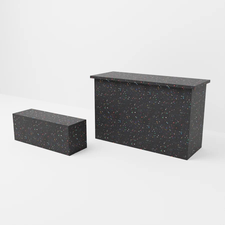 A counter and bench in the “Black, colour flecks” finish