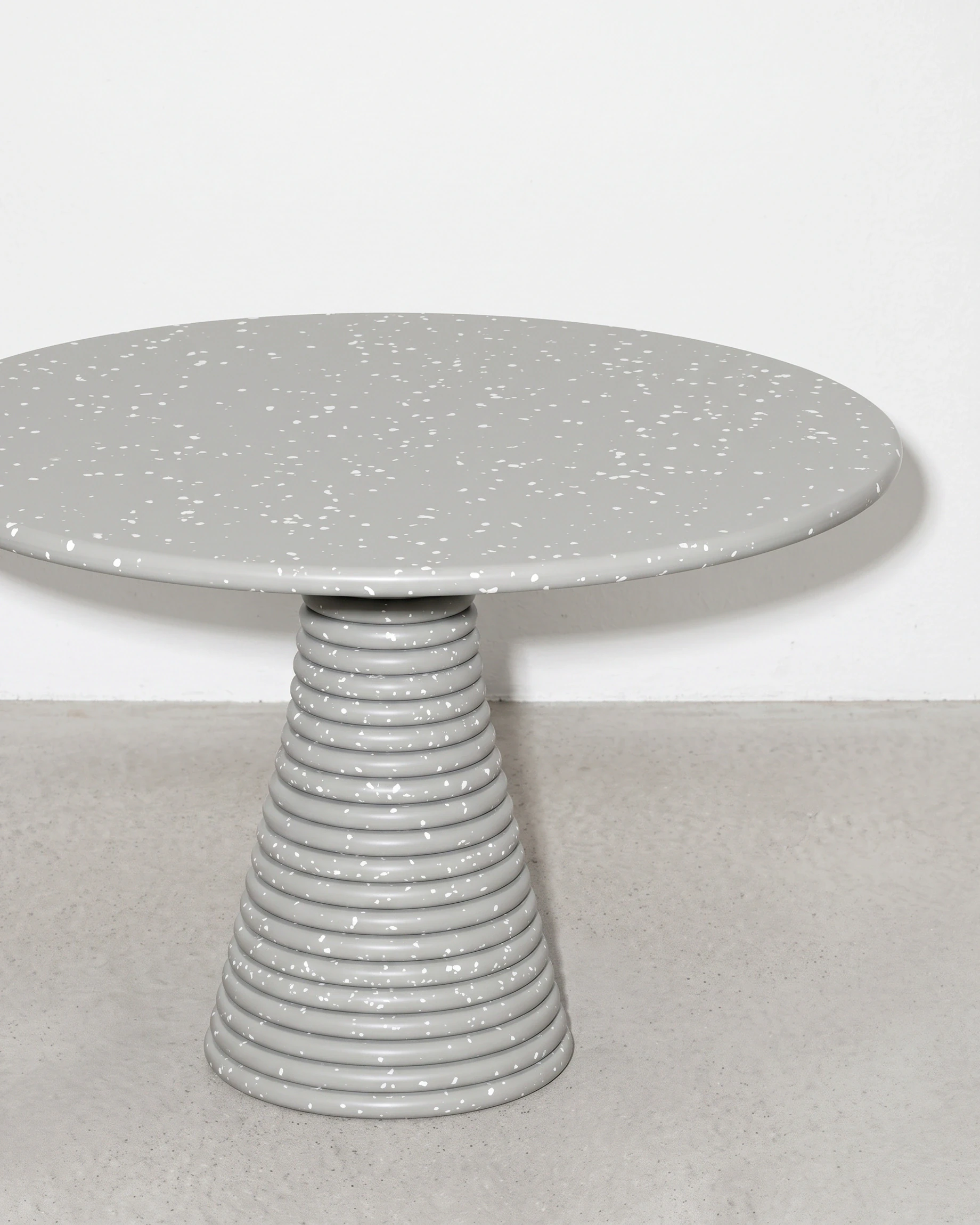 Weaver, stacked-disc table Ø80 × 52, cone leg, grey, white flecks: front right view