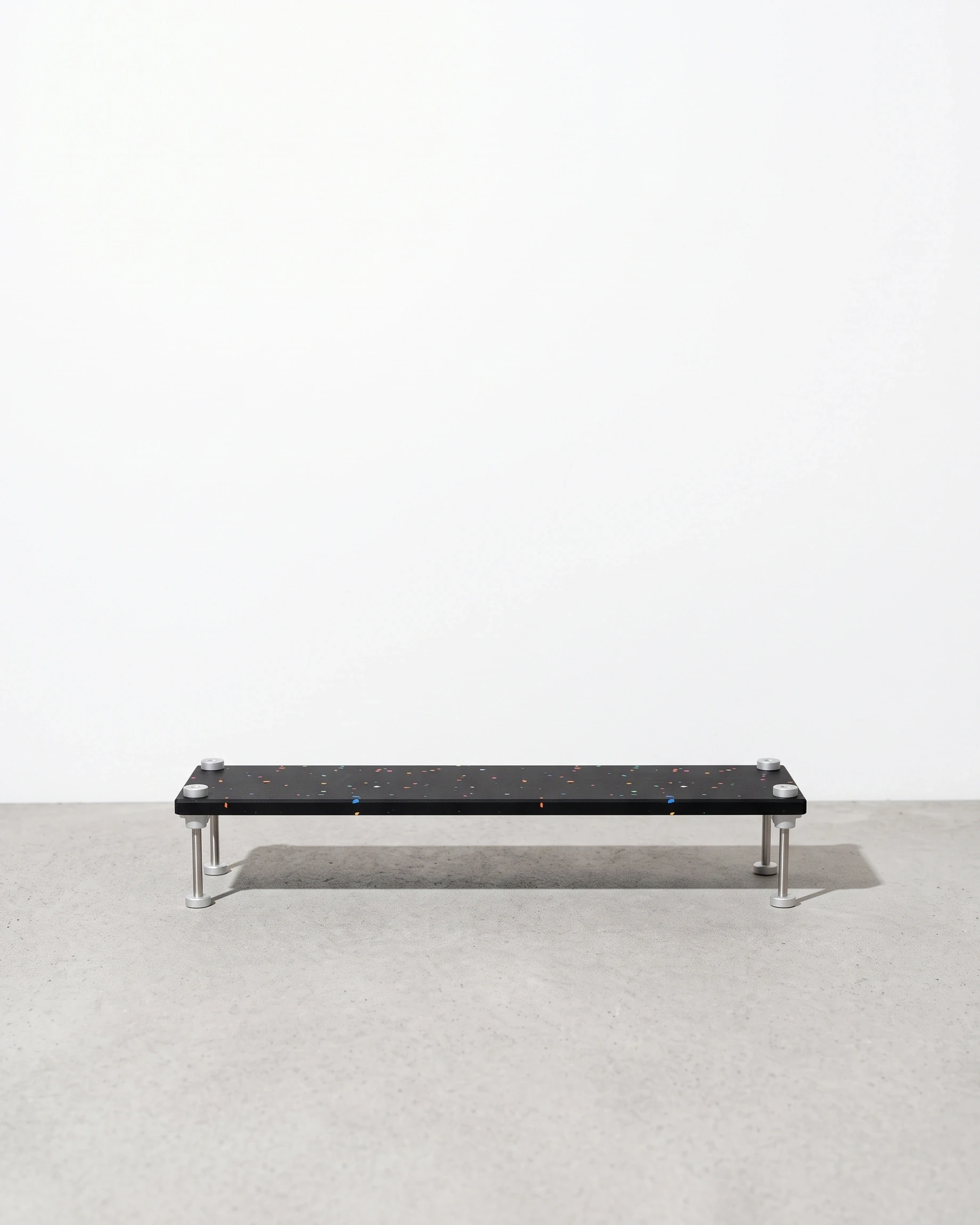 Shopkeeper, step riser 50 × 15, black, colour flecks: front view