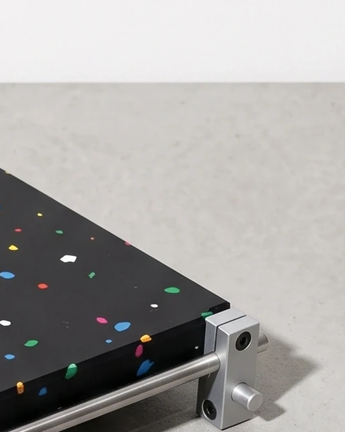 Cashier, organiser 18 × 13, black, colour flecks: top corner close-up