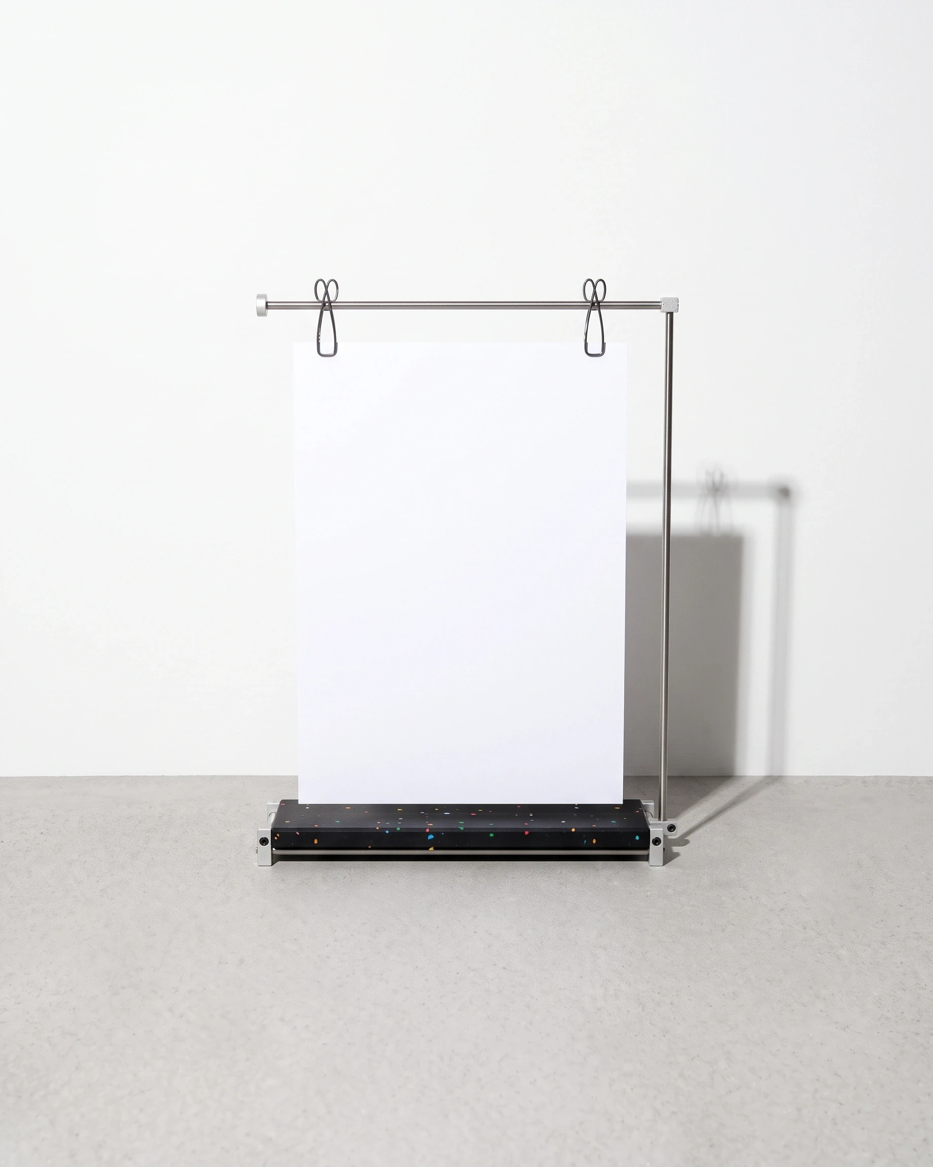 Poster, clip stand for A3, black, colour flecks: front view