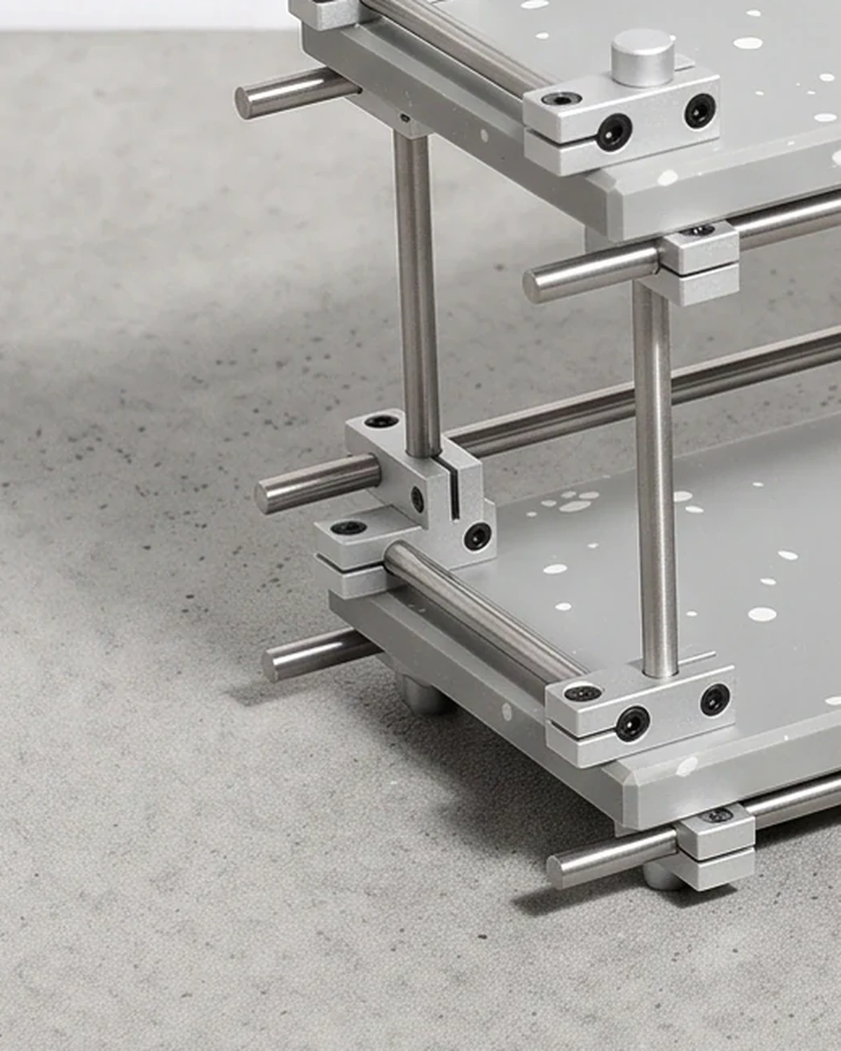 Chemist, two-level shelf 35 × 12, grey, white flecks: base close-up