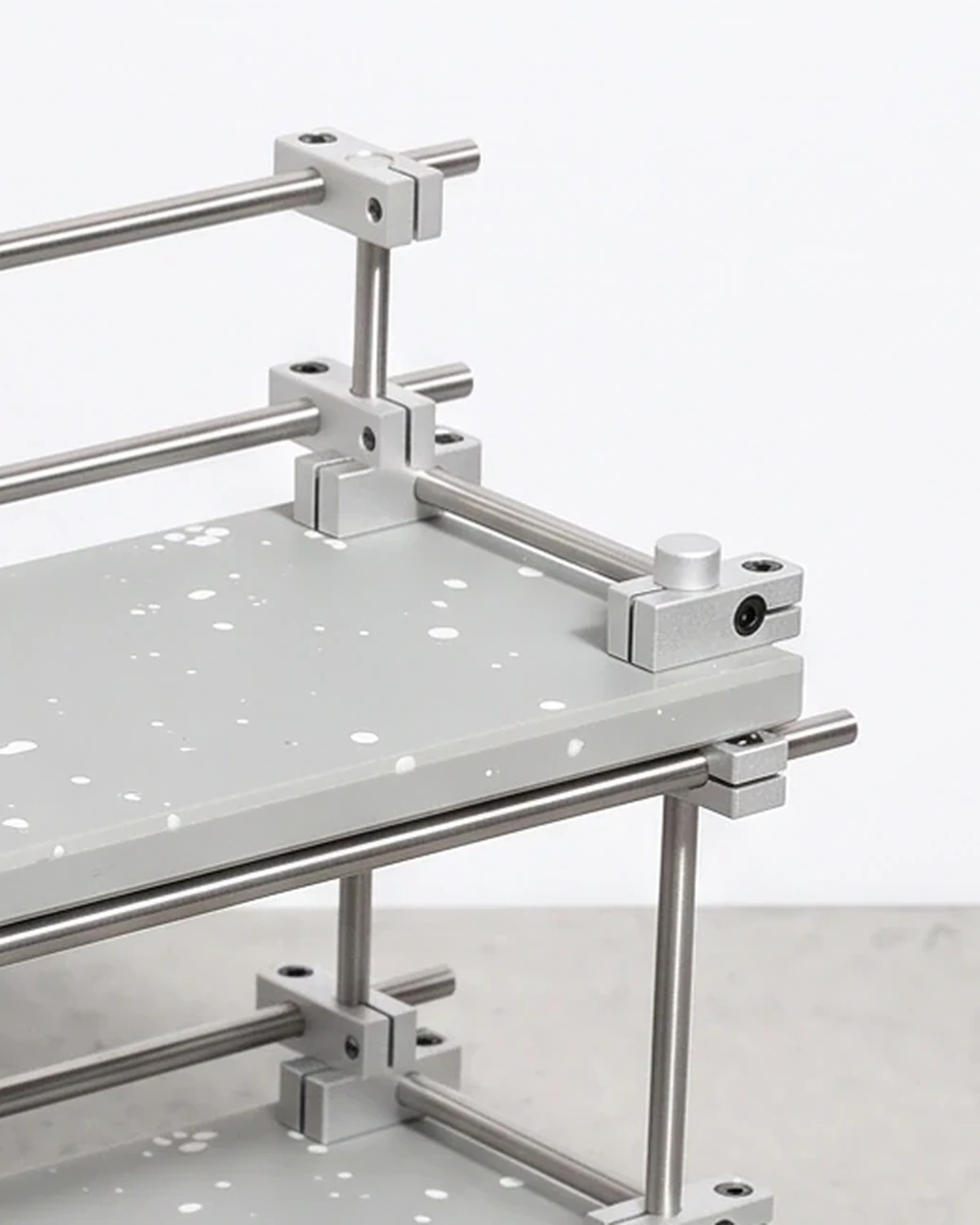 Chemist, two-level shelf 35 × 12, grey, white flecks: top corner close-up