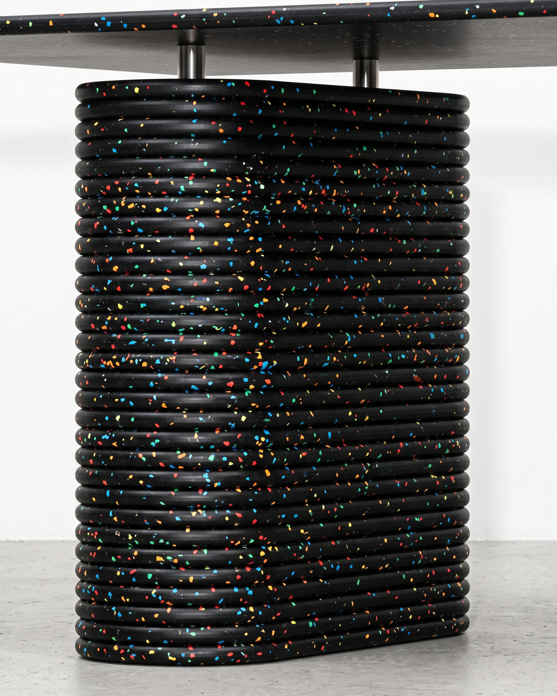 Notary, table on two supports 196 × 90, black, colour flecks: joint close-up