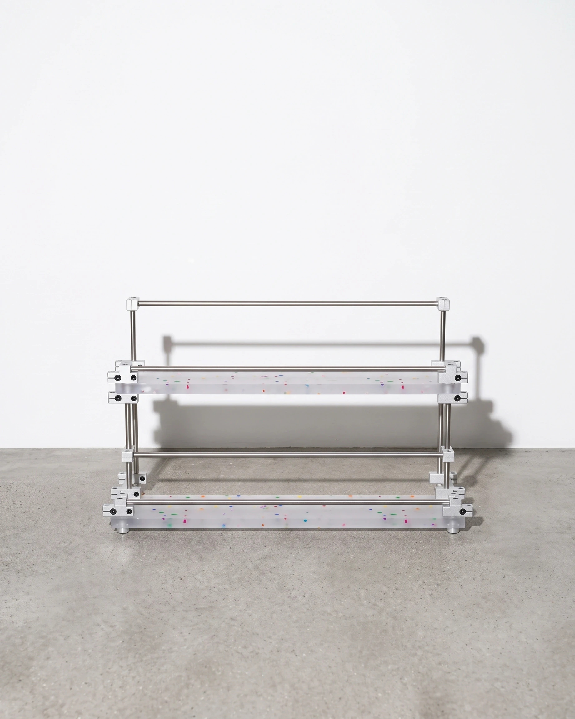 Apothecary, two-tier riser with raised edges 40 × 20, translucent, colour flecks: front view