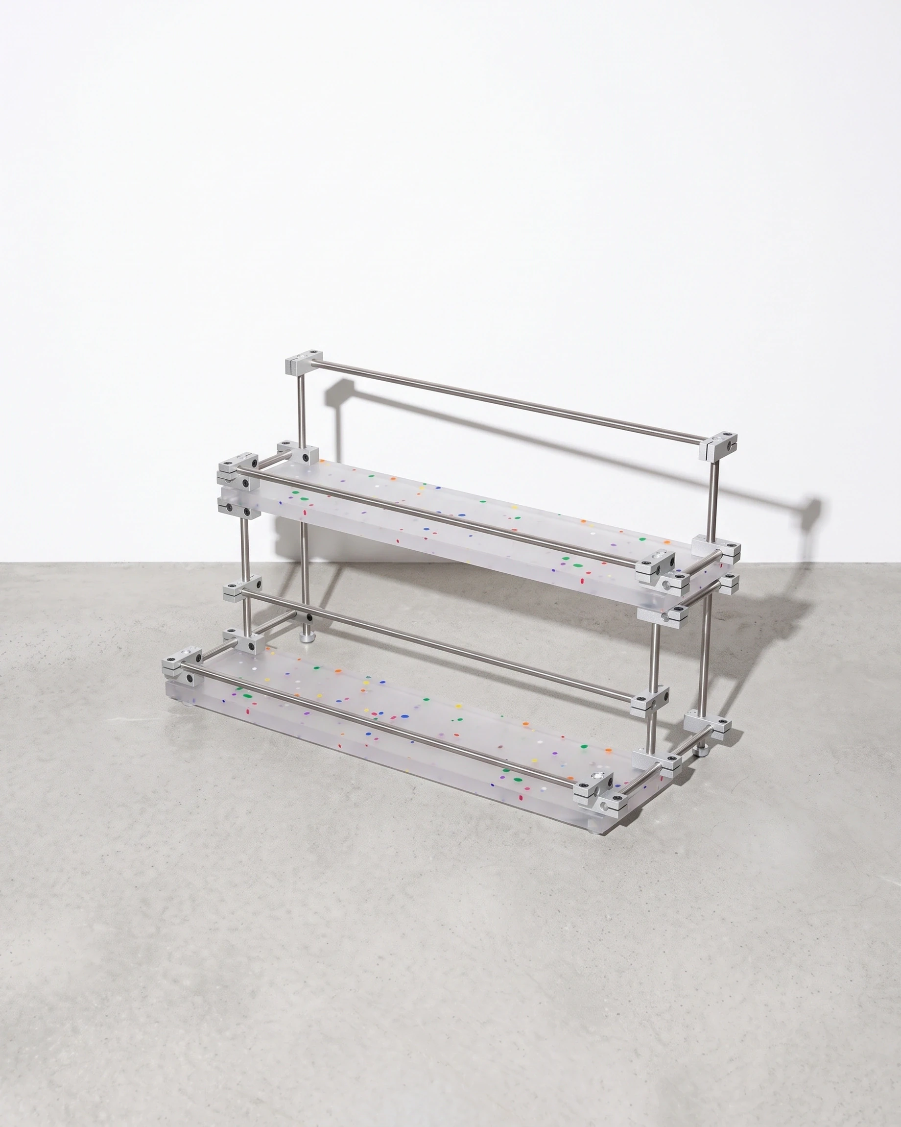 Apothecary, two-tier riser with raised edges 40 × 20, translucent, colour flecks: front right view