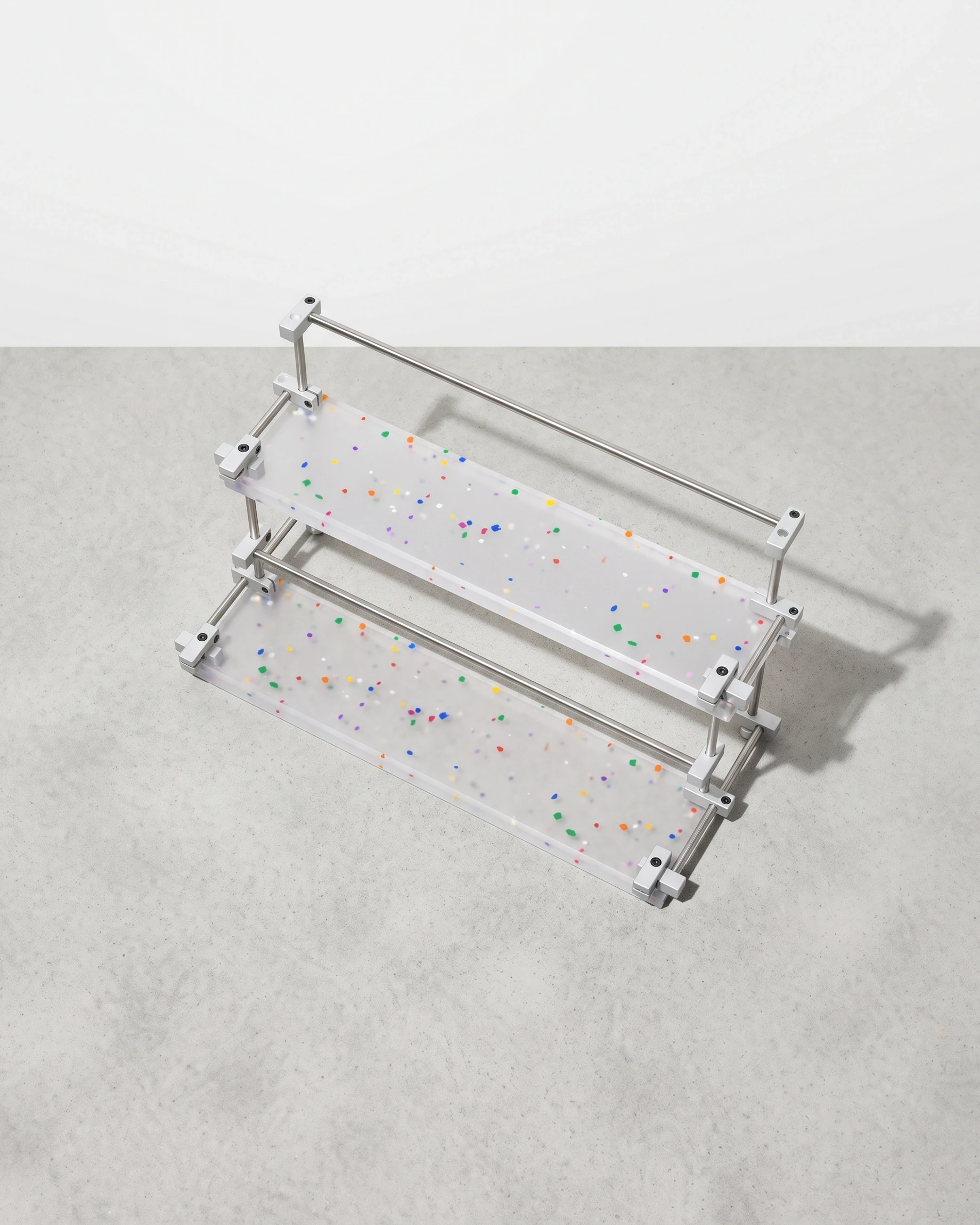 Apothecary, two-tier riser with raised edges 40 × 20, translucent, colour flecks: top view