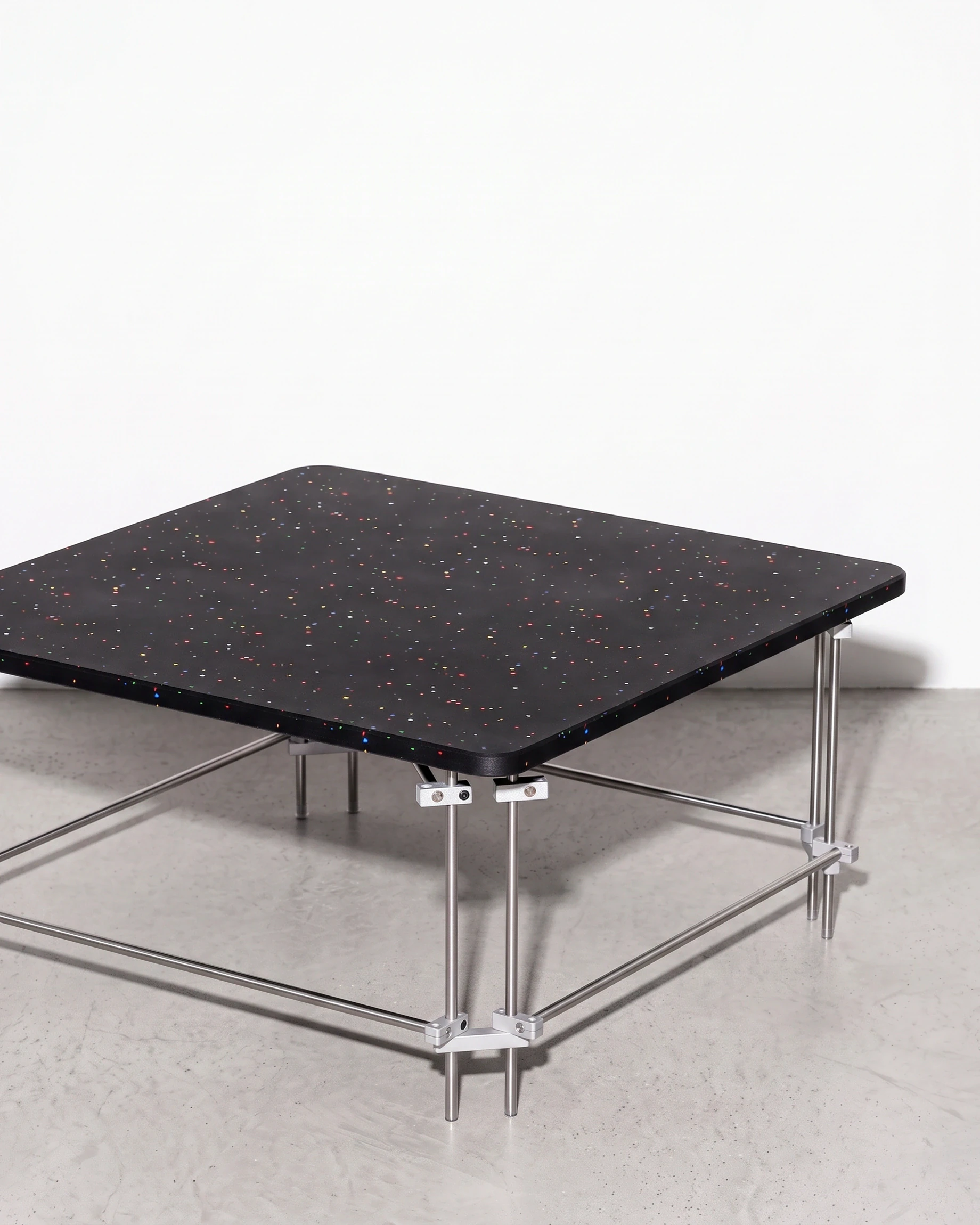 Chess Player, coffee table 80 × 80, black, colour flecks: front right view